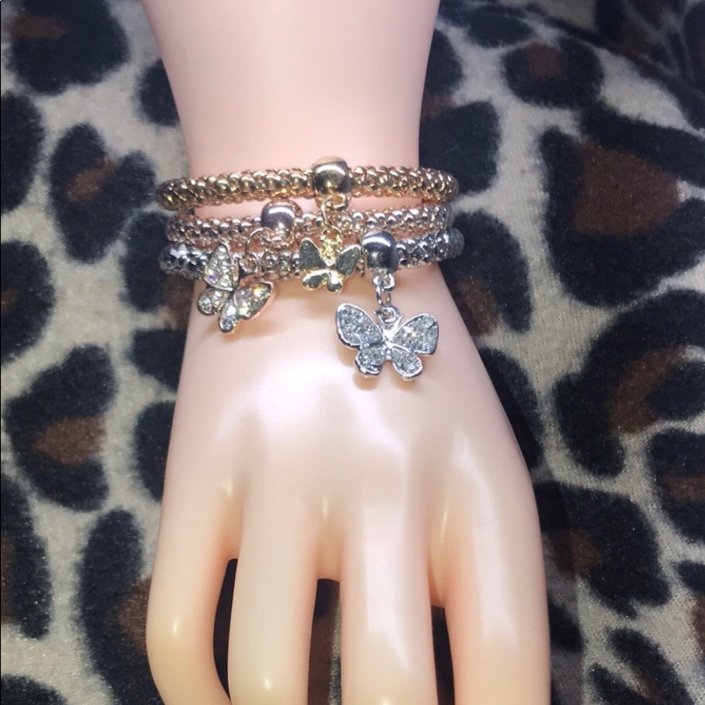 Link chain style bracelets with charms